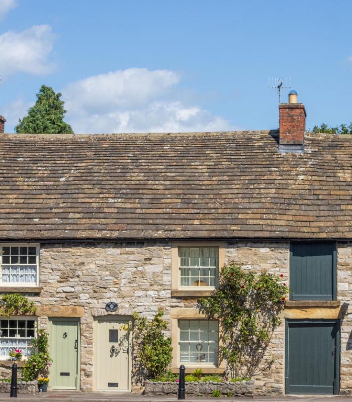 Greaves Lane at Ashford-in-the-Water in Peak District National Park at Derbyshire, England, with cottages visible.